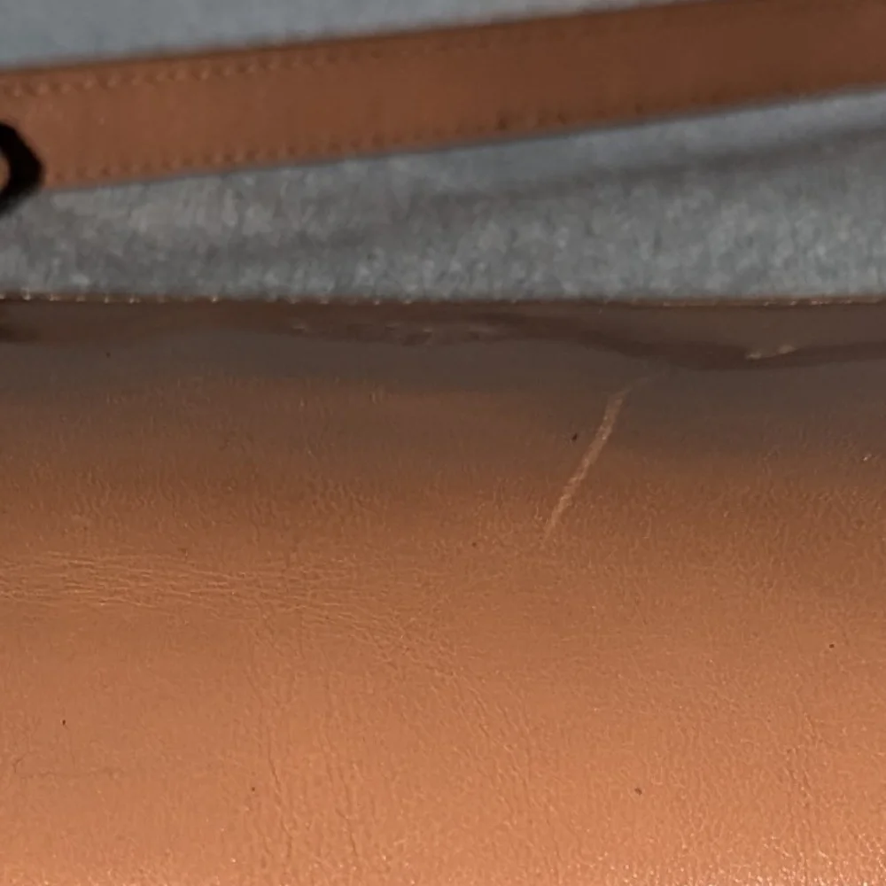 Monsac tan leather bag.